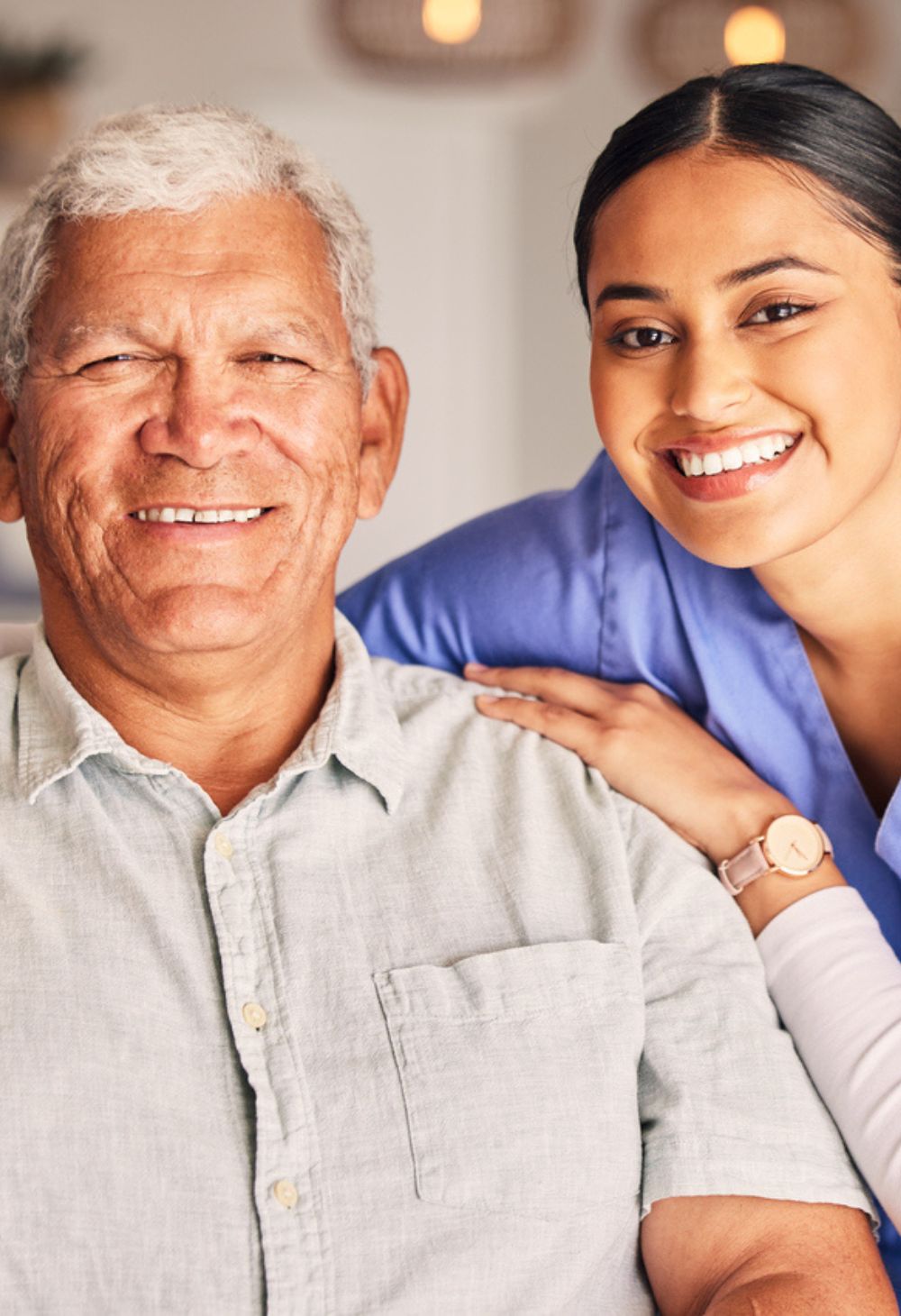 Caregiver smiling beside a senior man during Alzheimer’s and Dementia Care in Escondido, providing compassionate in-home support and companionship.