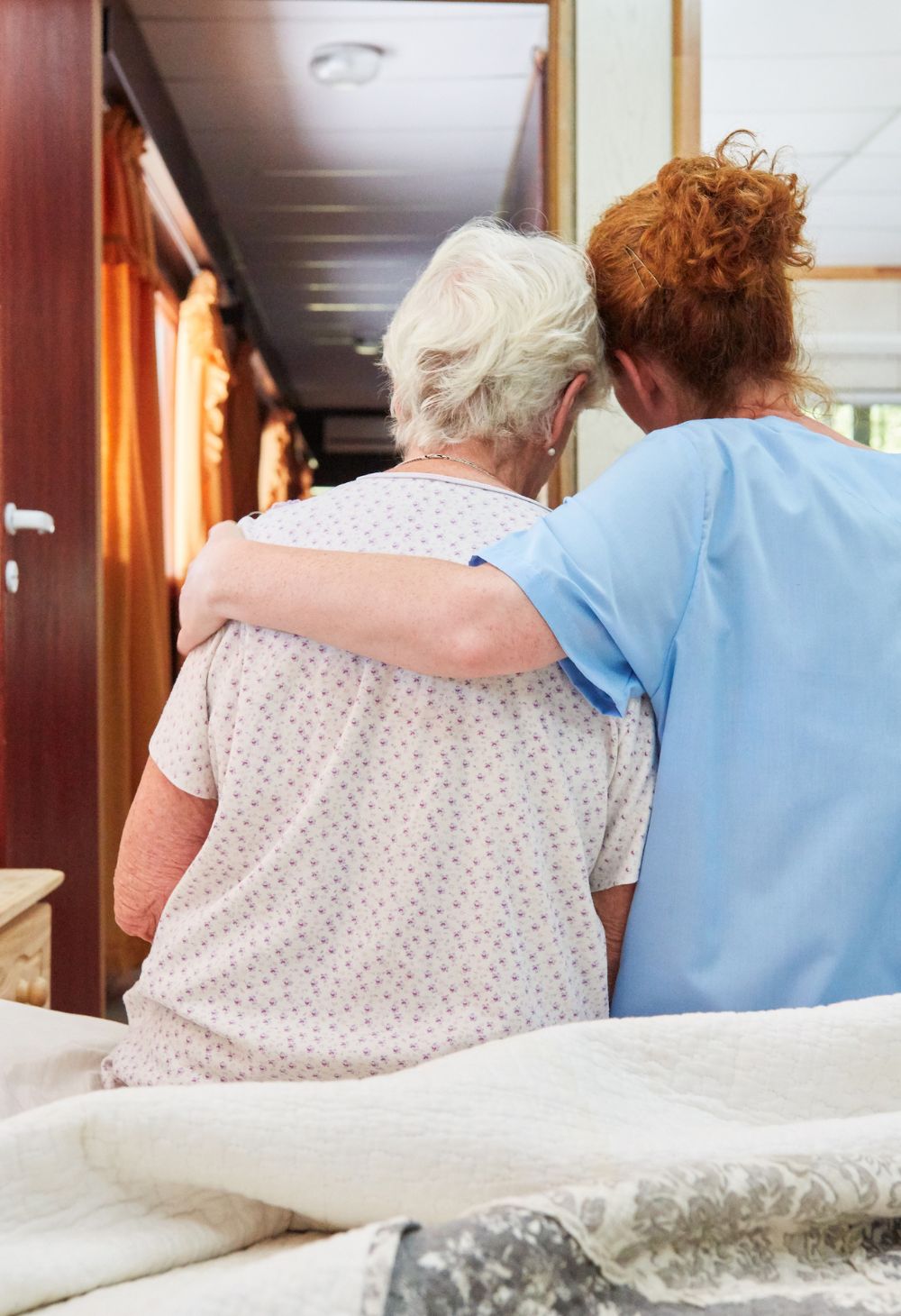 Hospice Care in Escondido (1) Caregiver comforting and supporting a senior during hospice care in Escondido, providing compassionate end-of-life care.